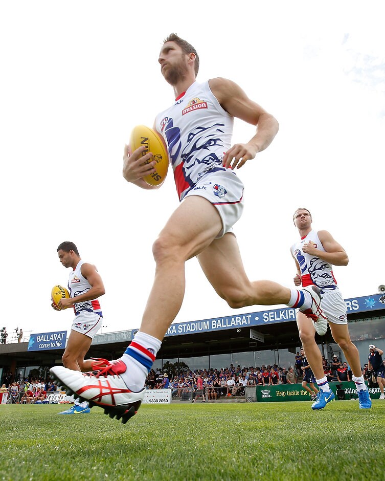 AFL 2015 NAB Challenge - Western Bulldogs v Melbourne Matthew Boyd of the Bulldogs runs onto the field during the 2015 NAB Challenge Week 3 match between the Western Bulldogs and the Melbourne Demons at Eureka Stadium, Ballarat on March 14, 2015. (Photo: Michael Willson/AFL Media)